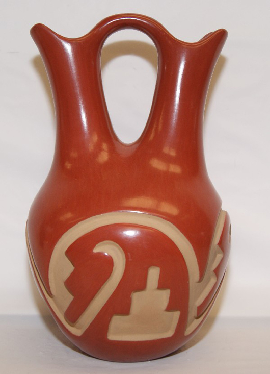 Santa Clara pottery wedding vase, 1970s, carved design, signed Belen Tapia, 11 inches by 6 1/2 inches. Estimate:  $800-$1,200. Image courtesy of R.G. Munn Auctions.