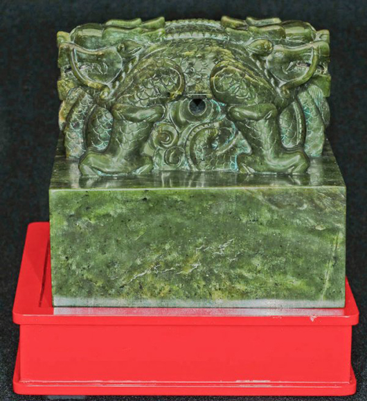 The large green jade seal of Empress Xiaomu is expected to sell for $30,000-$40,000. Adorned with a pair of dragons, the seal measures 5 1/8 inches by 5 1/8 inches. Image courtesy of Auction Gallery of the Palm Beaches.