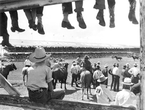 Looking through Fence with Boots at CFD Arena. Image courtesy Wyoming State Archives.