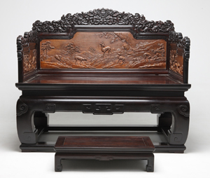 One of the Forbidden City thrones in the exhibiton is this highly carved example of the rare tropical hardwood zitan, cedar and lacquer. The throne is 50 inches wide. Copyright the Palace Museum, Beijing.