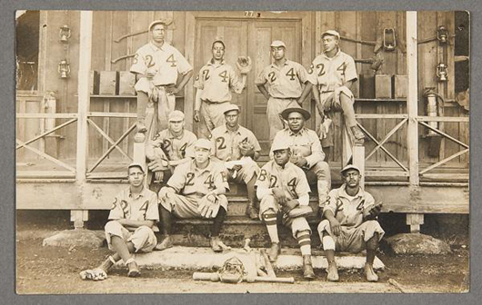 The inscription on the back of this real photo postcard identifies the players on the U.S. Army 24th Infantry’s Company B baseball team. They were 1913 champions of the Manila League in the Philippines. The card carries a $600-$900 estimate. Image courtesy of Jackson’s International Auctioneers & Appraisers.