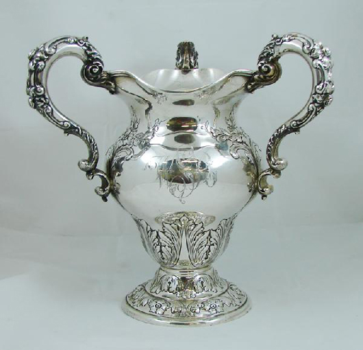 Gorham produced this sterling silver loving cup around the turn of the 20th century. It stands 12 1/2 inches tall and weights 58 troy ounces. Monogrammed, it is estimated at $800-$1,200. Image courtesy of Nest Egg Auctions.