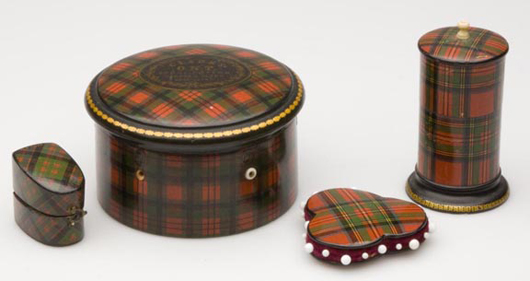 Two Stuart Tartanware sewing containers (right), a pincushion and a spool holder, comprise lot 206. Also pictured are a thimble holder, included in lot 207, and a J. Duff Tartanware spool container, lot 204. Image courtesy of Jeffrey S. Evans & Associates.