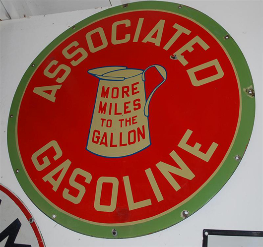 Associated Gasoline ‘More Miles to the Gallon’ single-sided porcelain sign, $9,350. Image courtesy of Matthews Auctions LLC.