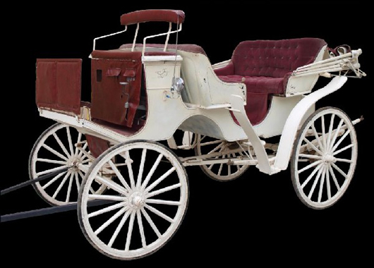 "Menno L. Kuhne, Nappannee, Indiana" is marked on the vis-à-vis horse-drawn carriage, which has facing passenger seats. The early 1900s carriage has a $4,000-$6,000 estimate. Image courtesy of Austin Auction Gallery.