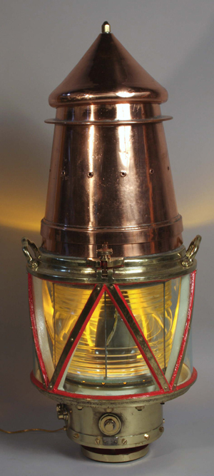 Copper and brass lightship beacon with fresnel glass lens, hinged and vented top, triangular protective glass panels, 49 inches tall, 20 inches in diameter, estimate: $8,000-$12,000. Image courtesy of Kaminski Auctions