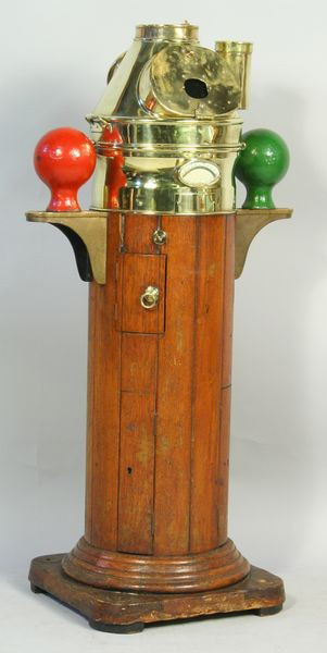 Early 20th-century ship's binnacle by Kelvin, Bottomley and Baird Ltd. of Glasgow and London, highly polished top and varnished base, 59 inches, estimate: $4,000-$6,000. Image courtesy of Kaminski Auctions