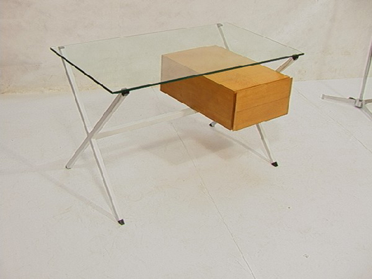 Franco Albini desk for Knoll, X Form legs, glass top with two drawers, tag in drawer, 28 inches high, 48 inches wide, 26 inches deep. Estimate: $1,600-$2,000. Image courtesy of Uniques and Antiques Inc.