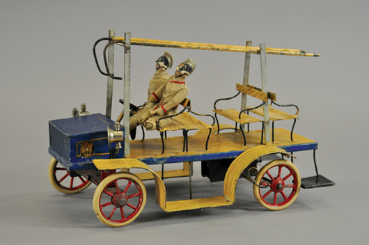 Circa-1900 hook & ladder truck, Germany, 14 inches, $6,000-$8,000. Bertoia Auctions image.