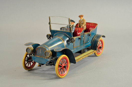 Gunthermann torpedo-style touring car, hand-painted tin, circa 1910, 15½ inches long, $6,000-$8,000. Bertoia Auctions image.