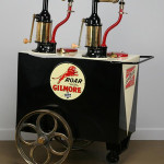 This Bennett double pump curbside lubester with dispensers to accommodate SAE 20 and SAE 30 motor oils is considered rare. It bears the ‘Roar With Gilmore Motor Oil’ brand logo. It has a $4,000-$6,000. Image courtesy of Great Gatsby’s Auction Gallery.