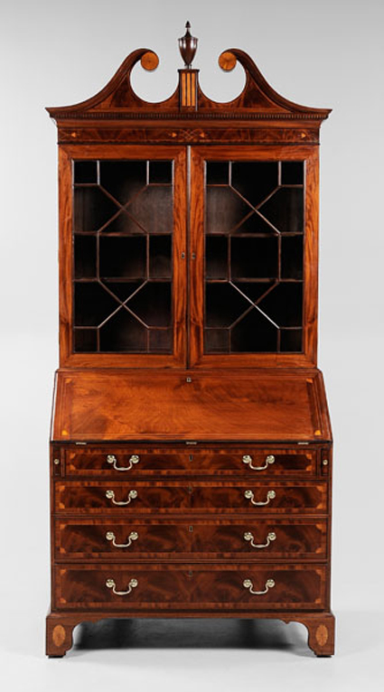 Standing 70½ inches and 43¼ inches deep, this massive late-18th-century Charleston desk and bookcase was recently conserved by David Beckford of Charleston, S.C. In highly figured mahogany veneers and elaborate inlays, this important piece of Southern furniture is expected to sell for $60,000 to $90,000. Brunk Auctions image.