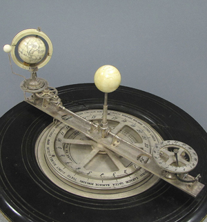 French ivory and silvered brass orrery timepiece, signed Charles Requier Horologer a Paris par L. Abassabor d’Angelierre en France 1898 on ormolu mounted stand. William Jenack image.