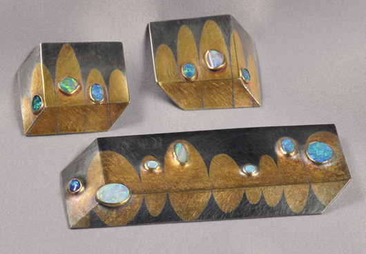 Mixed metal and opal suite, Michael Zobel, circa 1993, comprising a brooch and ear clips of geometric form bezel-set with opal tablets, sterling silver and gold mounts. Estimate $1,000-$1,500. Image courtesy of Skinner Inc.