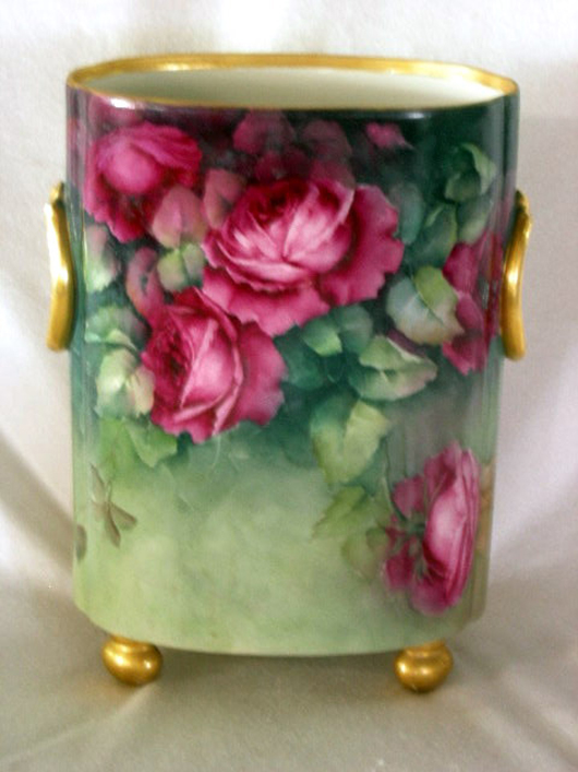 Limoges porcelain hand-painted floral cachepot trimmed in gold, 12 1/2 inches tall, $777. Image courtesy of Specialists of the South Inc.