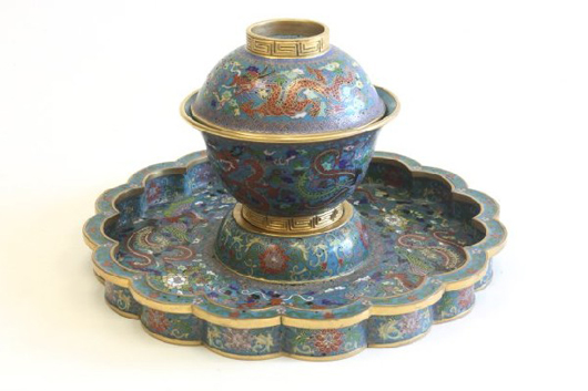 Cloisonné enamel covered bowl and stand depicting ‘Dragon and Phoenix,’ Qianlong four-character mark, approximately 9 inches in diameter by 5 1/2 inches high, est.  $20,000-$25,000. Image courtesy of Time & Again Auction Galleries.