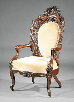 American Rococo carved and laminated Rosewood armchair, mid-19th century, attributed to John Henry Belter, New York, Fountain Elms pattern, tall padded back with floral crest, reticulated carving of oak leaves, ‘C’ and ‘S’ scrolls and flowers, shaped arms, serpentine seat rail and floral-carved cabriole legs, est. $12,000-$18,000. Image courtesy of Neal Auction Co.