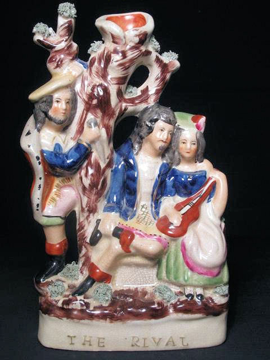 19th-century Staffordshire figurine titled The Rival, 12 inches high, estimate $150-$250. Auctions Neapolitan image.