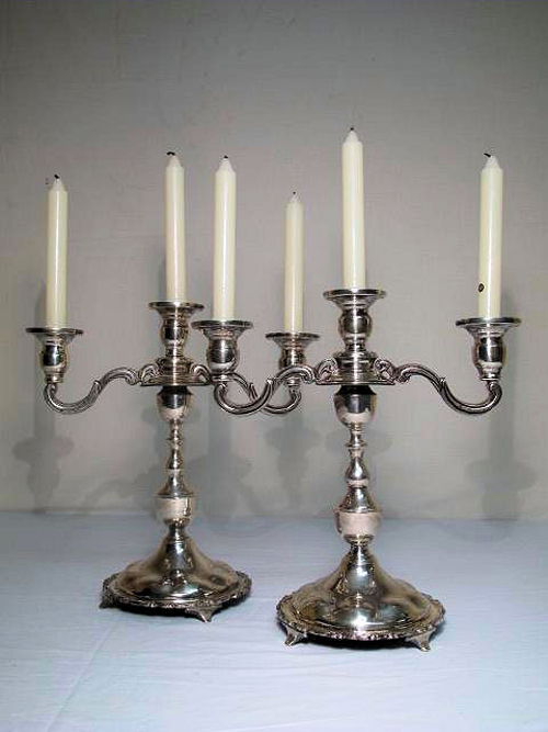 Pair of sterling silver three-arm candelabra, estimate $900-$1,200. Auctions Neapolitan image.