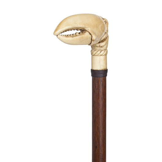 Ivory claw cane, late 19th century, rosewood shaft, leather collar and a metal ferrule, est. $1,000-$1,500. Image courtesy of Kimball M. Sterling Inc.