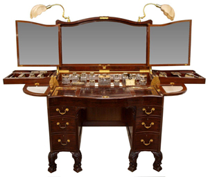 An extraordinary circa-1930 "Beau Brummel" dressing table with 30-piece Art Deco silver and cut glass vanity set produced by Goldsmiths & Silversmiths Co. Ltd., London. Estimate $20,000-$25,000. Austin Auction image.