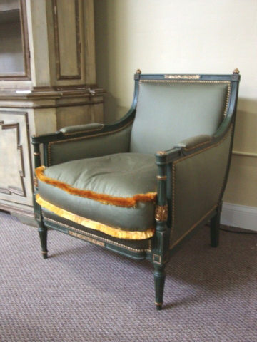 One of a pair of green painted and upholstered Louis XVI-style Bergere chairs, stamped Jansen (est. $4,000-$6,000). Image courtesy of Vintage Galleries.