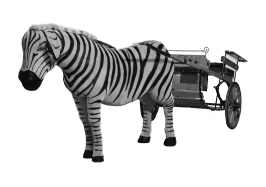 Stuffed life-size Steiff mohair zebra (est. $800-$1,200) pulling a vintage carriage in excellent condition (est. $1,000-$2,000). Image courtesy of Vintage Galleries.