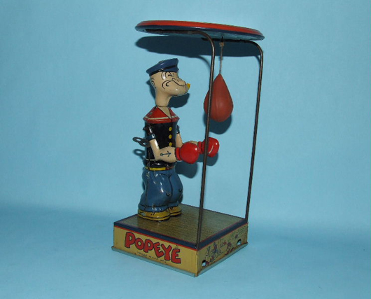 Chein Popeye Overhead Puncher tin windup with original key, pipe and celluloid bag. Estimate $2,000-$3,000. Image courtesy Toys of Times Past and LiveAuctioneers.com.