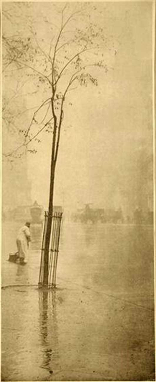 Spring Showers - The Street Cleaner, from the Alfred Stieglitz New York exhibition at the Seaport Museum that runs through Jan. 10, 2011. Image by permission of the Seaport Museum New York, Alfred Stieglitz Collection, Courtesy of the Board of Trustees, National Gallery of Art, Washington.