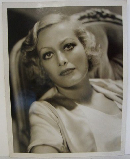 A Joan Crawford autograph accompanies this George Hurrell glamour portrait of the Oscar-winning actress. The photograph measures 10 inches by 13 inches. The estimate is $300-$400. Image courtesy of Mid-Hudson Auction Galleries.