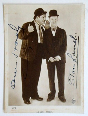 Signed ‘Oliver Hardy’ and ‘Stan Laurel,’ a photo postcard of the comedy team is considered rare. The 3-inch by 5-inch French sepia-tone print carries a $600-$800 estimate. Image courtesy of Mid-Hudson Auction Galleries.