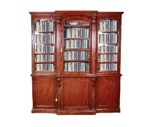 Nineteenth-century mahogany breakfront bookcase with three arched glazed doors, 91 1/2 inches high by 84 inches wide, est. $6,630-$10,606. Image courtesy of Sheppards Irish Auction House.