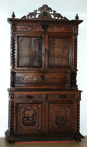 Carved animals and stylized foliage cover this Gothic Revival carved oak cabinet on chest, which was made in the early 1900s. It is 100 inches high, 56 inches wide and 23 inches deep. It has a $1,000-$1,500 estimate. Image courtesy of Gray’s Auctioneers.
