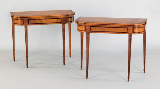 Pair of English Adams satinwood card tables, circa 1790, each with a rectangular top with ovolo corners and burl veneer edge over a conforming frame with drawer supported by square tapering legs with painted bellflower chains, 29 1/2 inches high by 36 inches wide, $4,000-$6,000. Image courtesy of Pook & Pook Inc