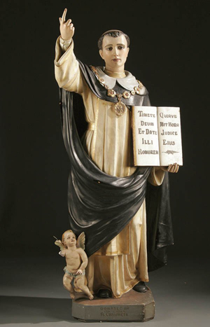 St. Thomas Aquinas is depicted in a circa 1920 polychrome plaster statue, which has glass eyes. The three-quarter life-size figure sold for $500 at an auction in 2007. Image courtesy of Jackson’s International Auctioneers & Appraisers and LiveAuctioneers archive.