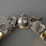 Diamond and gold bangle bracelet depicting two elephants, features 12 rose-cut diamonds, weighing a total of approximately 1.75 carats, accented by numerous smaller rose-cut diamonds weighing approximately 10.00 carats, pave set in silver topped 14-karat yellow gold, estimate: $3,500-$4,500. Image courtesy of Michaan’s Auctions.