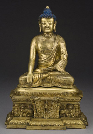 Chinese Qing gilt bronze shakyamuni Buddha seated on a throne, hands in Buddhist mudra, 14 1/2 inches high. Estimate: $20,000- $40,000. Image courtesy of Dallas Auction Gallery.