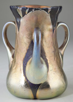 The top lot of the sale was this Tiffany & Co. Favrille glass three-handled vase, which sold for $62,100. Photo courtesy of Leland Little Auction & Estate Sales Ltd.