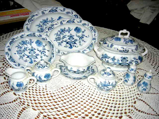 Blue Danube china service for 12, with extras and serving pieces, on a nice tablecloth. Image courtesy of Specialists of the South Inc.
