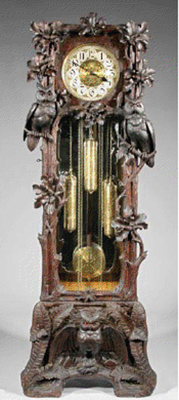 A highly carved Hans Winterhalder Black Forest walnut tall case clock, circa 1925, achieved $16,730. Image courtesy of Neal Auction Co.