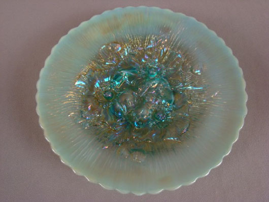 Carnival glass Poppy Show plate by Northwood in rare aqua color, 9 inches, hairline to bottom, estimate: $1,000-$2,000. Image courtesy of Strawser Auction Group.
