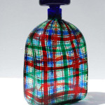 Christian Dior incorporated a Scottish tartan design into this blow glass decanter made by Barovier & Toso, Italy, in 1969. The decanter is 9 inches high, 5 inches wide, 3 inches deep and has a $5,000-$7,000 estimate. Image courtesy of Palm Beach Modern Auctions.