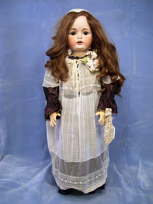 Large J.D. Kestner 34-inch German doll with composition body, bisque head, jointed legs. Image courtesy of Browne Auction Specialists.