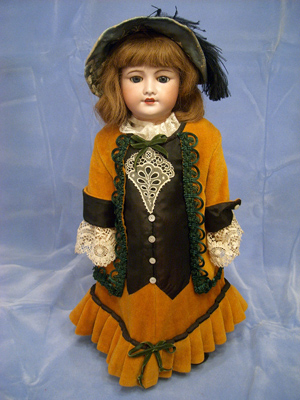 French 21-inch doll by Unis, jointed, with composition body and bisque head. Image courtesy of Browne Auction Specialists.