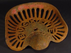 By 1900 the Buckeye Mower and Reaper Co. of Akron, Ohio, was a leading manufacturer of farm equipment, shipping its products worldwide. This cast-iron Buckeye seat sold at auction in England in 2007. Image courtesy of Eastbourne Auction Rooms and LiveAuctioneers archive.