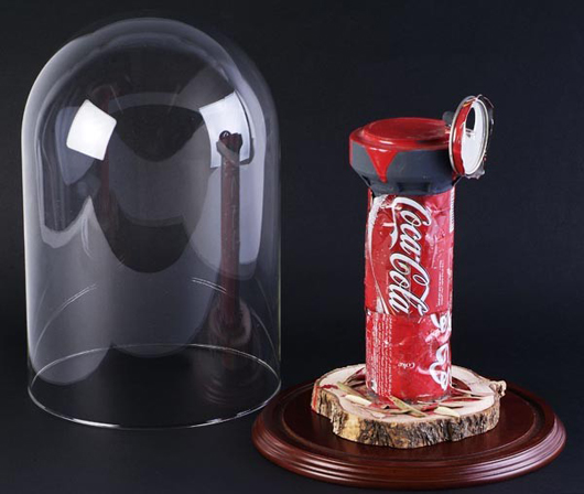 Banksy (British, b. 1975) and Peter Kennard (British, b.1949) ‘Watch Tower,’ 2007, wood, acrylic, olive leaves and Coke can sculpture, unique work, signed by Banksy and Peter Kennard on reverse, 10 inches by 6 inches, est. $15,800-$23,700. Image courtesy of Bloomsbury Auctions.