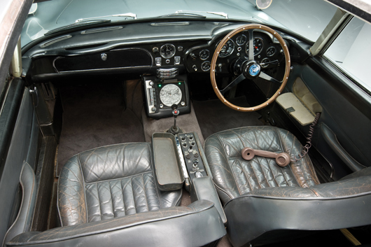 Overhead view of dashboard in James Bond's Aston Martin, image copyright Shooterz. Car to be auctioned Oct. 27 by RM Auctions.