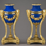 These signed Henry Dasson urns with matte blue porcelain bodies in fine gilt bronze are dated 1884. The pair has an estimate of $15,000-$25,000. Image courtesy of Dallas Auction Gallery.