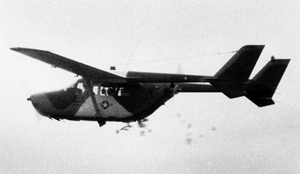 The 0-2 Skymaster, shown dropping leaflets over Vietnam in the 1960s, is a military version of the Cessna 337 Super Skymaster. Image courtesy of Wikimedia Commons.