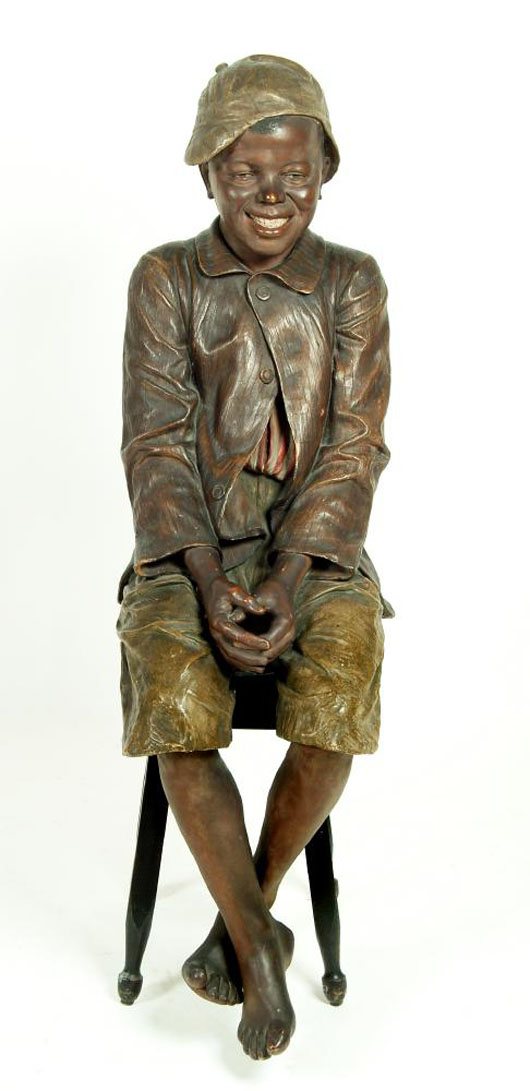 An interesting early 20th-century Goldscheider figure of a young fisherboy, which made £6,000 ($9,500) at Hartleys.